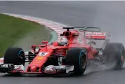  ??  ?? Ferrari driver Sebastian Vettel in the second practice session of the Japanese GP in Suzuka on Friday. —