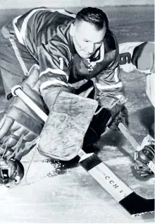  ?? POSTMEDIA NETWORK FILES ?? Toronto Maple Leafs goaltender Johnny Bower uses his famous pokecheck to knock the puck away from Montreal Canadiens’ forward Ralph Backstrom during a 1964 game.