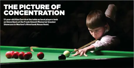  ??  ?? 12-year-old Alex Currid at the table as local players took on Steve Davis at the Frank Sinnott Memorial Snooker Showcase in Wexford’s Riverbank House Hotel.