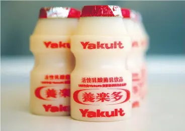  ?? NELSON CHING / BLOOMBERG NEWS FILES ?? Dressed in its familiar red foil, yakult is a popular probiotic Korean milk drink.