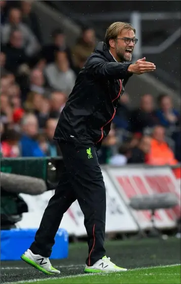  ??  ?? Jurgen Klopp on the sideline during Liverpool’s win over Swansea CIty.