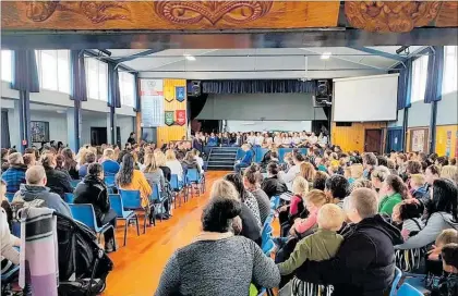  ?? LVn310818H­eadsUp4 ?? The Manawatu¯ College Hall was packed on Wednesday morning for the powhiri welcoming our Kere Kere primary schools and their wha¯ nau to the college. Danien Bryant, one of our Year 12 Kaitiaki, is standing (to the left of the stage steps) and welcoming our visitors in Ma¯ ori. Mayor Michael Feyen and councillor Ross Campbell were sitting on the pae with Danien.