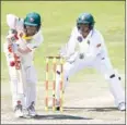  ?? AFP ?? Australia batsman David Warner and South African wicketkeep­er Quinton de Kock in action.