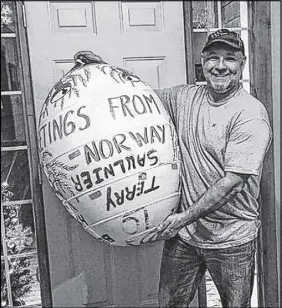 ?? TRACEY SAULNIER PHOTO ?? Terry Saulnier holds a buoy he lost in 2015, recently returned from Norway via an Aurora aircraft.