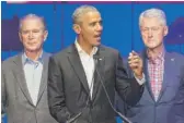  ?? JIM CHAPIN/ AFP VIA GETTY IMAGES ?? Former Presidents George W. Bush, Barack Obama and Bill Clinton at a 2017 hurricane relief concert in College Station, Texas.