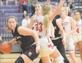  ?? RICK PECK/SPECIAL TO MCDONALD COUNTY PRESS ?? McDonald County’s Jaylie Sanny takes the ball to the basket during Webb City’s 42-33 win in the semifinals of the district basketball tournament on March 3 at Monett High School.