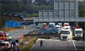  ??  ?? The dramatic scene on the M20 in Kent, England, after the bridge collapsed when it was hit by a truck carrying a digger.