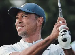  ?? MARK LENNIHAN THE ASSOCIATED PRESS ?? Tiger Woods opened and closed with a disappoint­ing 4-over 75 at the Northern Trust golf tournament at Liberty National Golf Course.