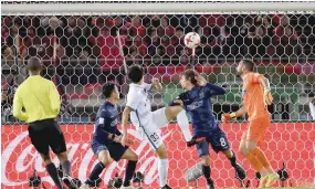  ?? — AFP ?? Kashima Antlers midfielder Mu Kanazaki (C) heads the ball to score his team’s second goal against Auckland City during the Club World Cup match in Yokohama.