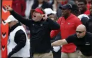  ?? JOHN BAZEMORE THE ASSOCIATED PRESS ?? In this Saturday, Nov. 24, 2018, file photo, Georgia head coach Kirby Smart, left, is restrained by an assistant coach as he yells to his players from the sideline during the second half an NCAA college football game against Georgia Tech, in Athens, Ga. Smart and his fourth-ranked Bulldogs are preparing to face what he calls “one of the most elite group of skill players I’ve seen assembled in college football.”