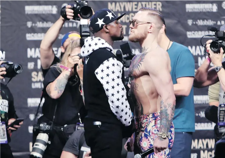  ?? — THE ASSOCIATED PRESS FILES ?? Floyd Mayweather Jr., left, and Conor McGregor aren’t breaking new ground in their matchup between the boxing and mixed martial arts superstars.