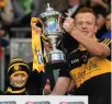  ??  ?? Amy O’Connor, who inspired Dr Crokes to All-Ireland victory, lifts the Andy Merrigan Cup with captain Johnny Buckley.