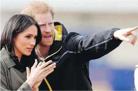  ?? AP ?? Meghan Markle and Prince Harry at last Friday’s U.K. team trials in Bath, England, for the 2018 Invictus Games Sydney, Australia.
