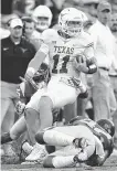  ?? Harry How / Getty Images ?? Sam Ehlinger led Texas to the cusp on a win over USC in 2017, but the team fell in OT.