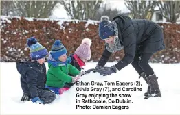  ?? Photo: Damien Eagers ?? Ethan Gray, Tom Eagers (2), Olivia Gray (7), and Caroline Gray enjoying the snow in Rathcoole, Co Dublin.