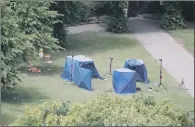  ??  ?? KNIFING PROBE: Police tents in Forbury Gardens in Reading town centre at the scene of a multiple stabbing attack.