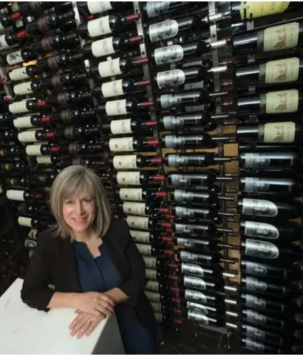  ?? RICK MADONIK/TORONTO STAR ?? Anne Martin, head sommelier for MLSE, in the wine cellar of the Platinum Club at the Air Canada Centre.