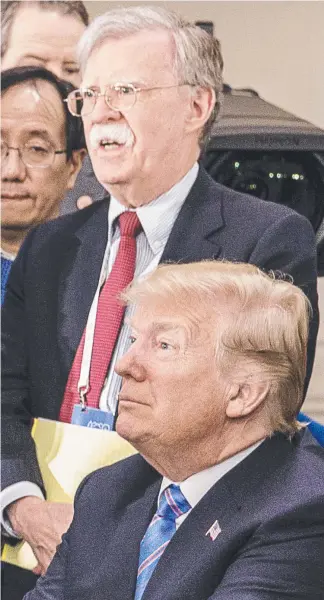  ?? Pictures: GETTY/AFP ?? John Bolton, seen with Donald Trump during his time as national security adviser, claims the President sought help from China’s Xi Jinping (inset) over his re-election bid.