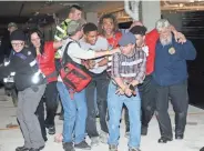  ??  ?? Police officers and EMTs train on evacuating wounded from a bomb blast area and recognizin­g secondary explosives.