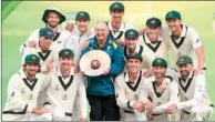  ?? (AFP) ?? The Australian players celebrate with the trophy after they beat Pakistan on the fourth day of the 2nd Test in Adelaide on Monday.