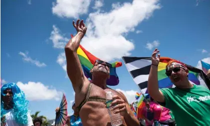  ?? ?? People take part in the Puerto Rico Pride Parade in San Juan on Sunday. Photograph: Ricardo Arduengo/AFP/Getty Images