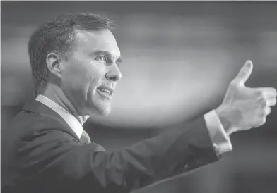  ?? PAUL CHIASSON / THE CANADIAN PRESS ?? Finance Minister Bill Morneau is reported to be considerin­g using his fall economic update to help boost Canada’s weak economy. That is, after handing out billions in cheques, he plans yet more fiscal stimulus, Andrew Coyne writes.