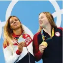  ?? (Reuters) ?? AMERICAN SWIMMER Lilly King (right) of USA and Russia’s Yulia Efimova (left) pose with their medals in the 100m breaststro­ke on Monday night. Gold winner King was openly critical of Efimova, who has tested positive for drugs multiple times.