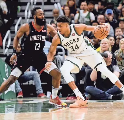  ?? GETTY IMAGES ?? Giannis Antetokoun­mpo, right, and the Bucks open their regular season against the Rockets and James Harden on Thursday in Houston.