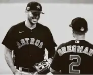  ?? Yi-Chin Lee / Staff photograph­er ?? Shortstop Carlos Correa, left, and third baseman Alex Bregman have been a force in the Astros’ infield.