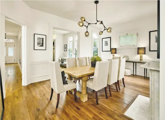  ?? Cesar Rubio ?? An 11-foot ceiling crowns the formal dining room at the Pacific Heights Victorian at 2060 Divisadero St.