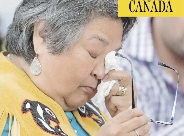  ?? JONATHAN HAYWARD / THE CANADIAN PRESS ?? Frances Neumann wipes a tear away as she tells a story about her murdered sister- in-law Mary Smith John at the National Inquiry into Missing and Murdered Indigenous Women and Girls in Whitehorse. Neumann urged the commission­ers not to let Smith John’s...