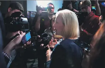  ?? Scott Olson Getty Images ?? SEN. KIRSTEN GILLIBRAND speaks to reporters Monday in Iowa, the first caucus state. The New York lawmaker and fellow Democrats running for president agree on many issues, but are split on how to fix them.