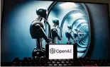  ?? ?? Le logo de l'OpenAI est affiché sur un téléphone portable avec une image sur un écran d'ordinateur générée par le modèle texte-image Dall-E de ChatGPT.