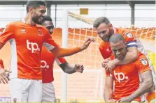  ??  ?? LATE SHOW Blackpool’s Kyle Vassell celebrates his second