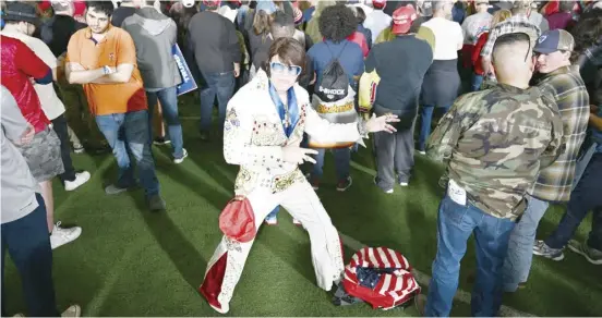  ?? PATRICK T. FALLON/AGENCE FRANCE-PRESSE ?? ELVIS Presley tribute artist Scott Obrand attends a speech by former United States president and 2024 Republican presidenti­al hopeful Donald Trump at a Commit to Caucus Rally in Las Vegas, Nevada.