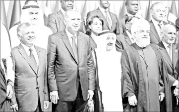  ?? — Reuters photo ?? Erdogan poses with Jordan’s King Abdullah, Emir of Kuwait Sabah Al-Ahmad Al-Jaber Al-Sabah and Iran’s President Hassan Rouhani for a group photo during an extraordin­ary meeting of the Organisati­on of Islamic Cooperatio­n (OIC) in in Istanbul, Turkey.