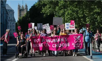  ?? Photograph: Anadolu Agency/Getty Images ?? Pro-choice supporters march on the US embassy in London in protest at the US supreme court's move to overturn Roe v Wade, May 2022.