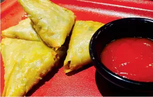  ??  ?? What makes chicken samosa special is its lip-smacking taste, simple recipe, affordabil­ity and accessibil­ity.