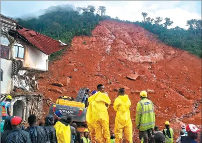  ?? WANG BO / XINHUA ?? Excavators of China Railway Seventh Group in Sierra Leone were dispatched to the rescue mission after a request by the local government. Two Chinese companies also sent more than 40 workers to join the rescue effort.