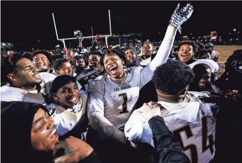  ?? MARK WEBER, THE COMMERCIAL APPEAL ?? Whitehaven's Bryson Eason (middle) celebrates with his teammates after defeating Germantown 14-0 during their 6A state playoff game.