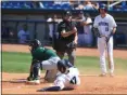  ?? TIM PHILLIS — FOR THE NEWS-HERALD ?? Captains baserunner George Valera is tagged out by Great Lakes catcher Jair Camargo on an attempted steal of home plate in the regular-season finale at Classic Park on Sept. 2.