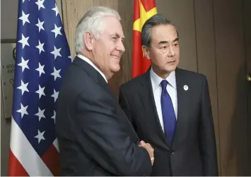  ?? (AP) ?? Chinese Foreign Minister Wang Yi , right, and US Secretary of State Rex Tillerson pose for a photograph during their bilateral meeting on the sidelines of the 50th Associatio­n of Southeast Asian Nations (Asean) Regional Forum (ARF) in Pasay City,...