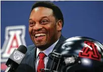  ?? Mike Christy / Arizona Daily Star ?? The smile is back on Kevin Sumlin’s face as he’s introduced as Arizona’s new coach Tuesday in Tucson, Ariz.