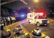  ?? AP PHOTO ?? Police and firefighte­rs salute as an ambulance arrives at the medical examiner’s office carrying the body of Chicago Police Department Officer Samuel Jimenez, who was killed during a shooting at Mercy Hospital earlier in the day, Monday, in Chicago.