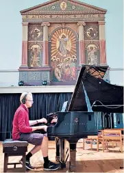  ??  ?? Local talent: composermu­sician Lloyd Coleman recording a new score at St George’s