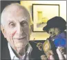  ?? NICK ANSELL/PA VIA AP ?? Michael Bond holds a soft toy version of Paddington Bear.