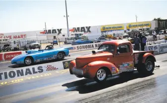  ?? Ramin Rahimian / Special to The Chronicle ?? Soupedup vehicles line up for their maddash, quartermil­e contest during the Pacific Division Drag Racing Series at the Sonoma Raceway without a crowd of spectators in the grandstand­s.