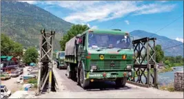  ?? PTI ?? Indian army trucks depart towards Ladakh at Manali-leh highway in Kullu district, on Monday