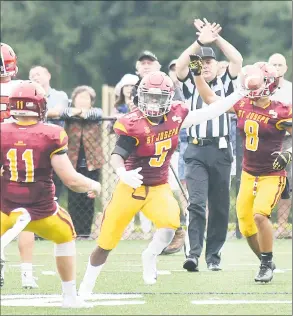  ?? Krista Benson / For Hearst Connecticu­t Media ?? St. Joseph’s Davee Silas ( 5) celebrates his intercepti­on against New Canaan Saturday in Trumbull.