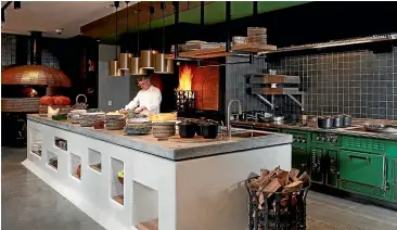  ??  ?? Chef Sean Connolly in the kitchen in the hotel’s Esther restaurant.